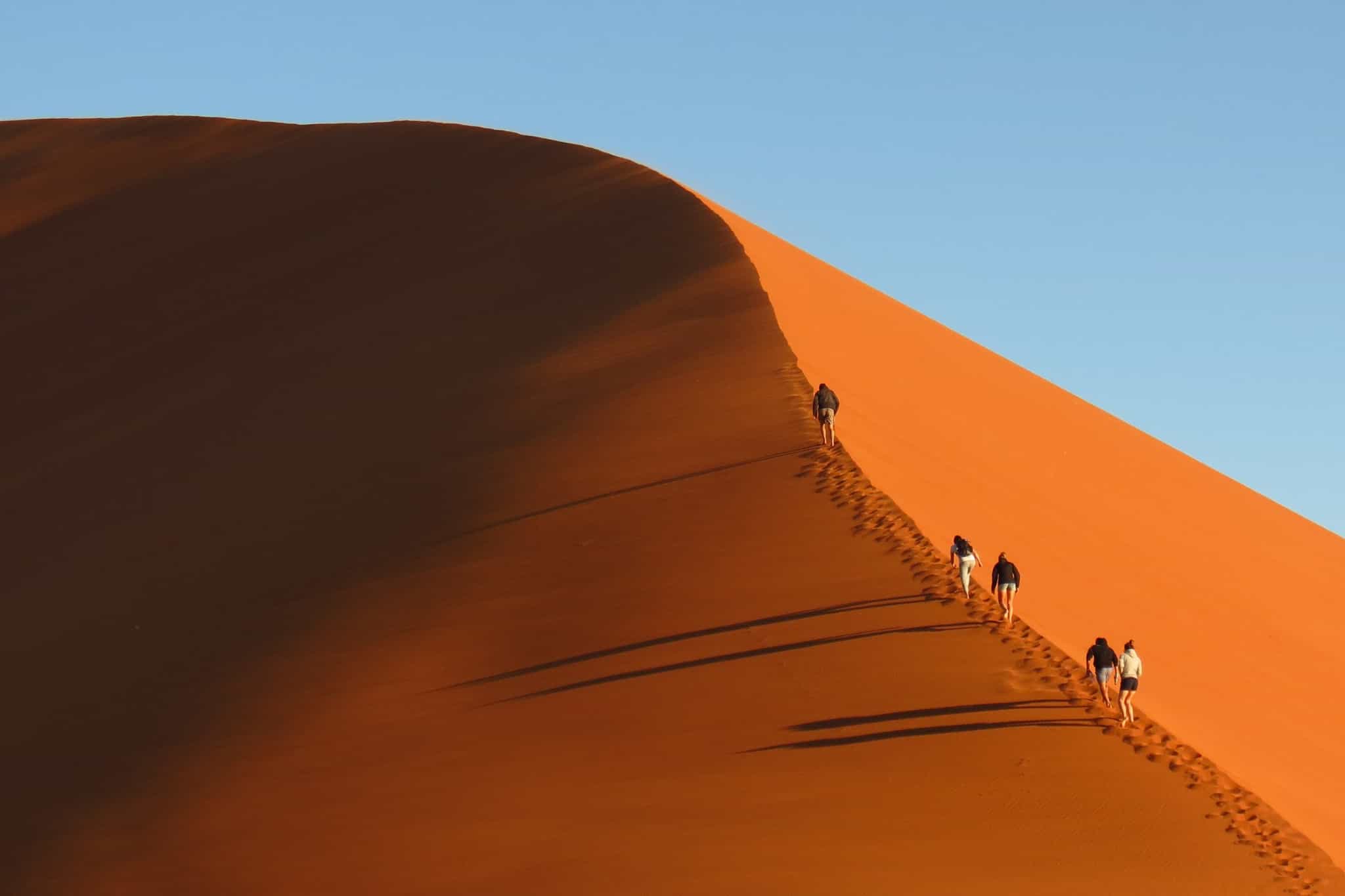 People climbing Dune 45 in Namibia