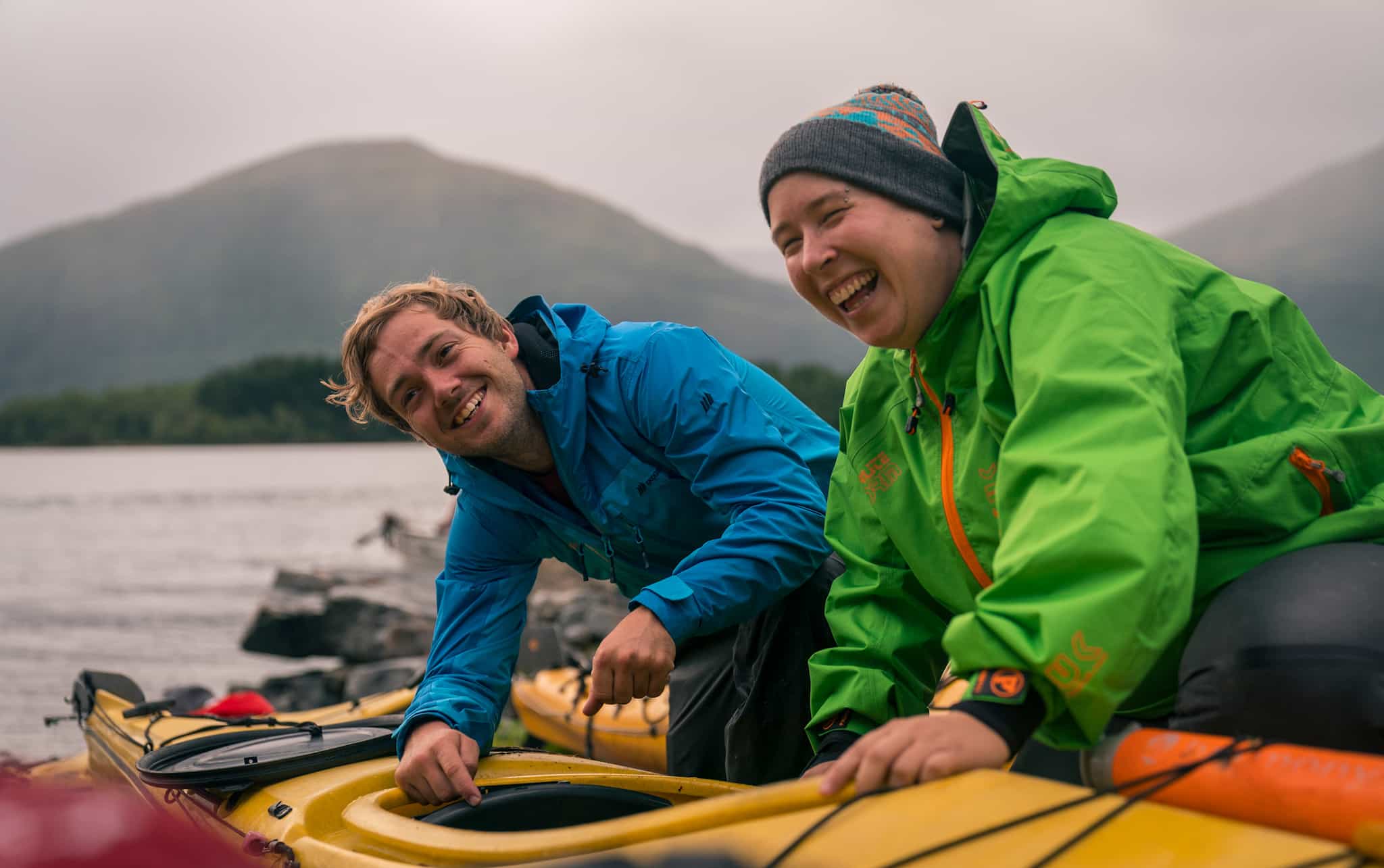 Two people preparing to kayak on Norway's Great Fjords
