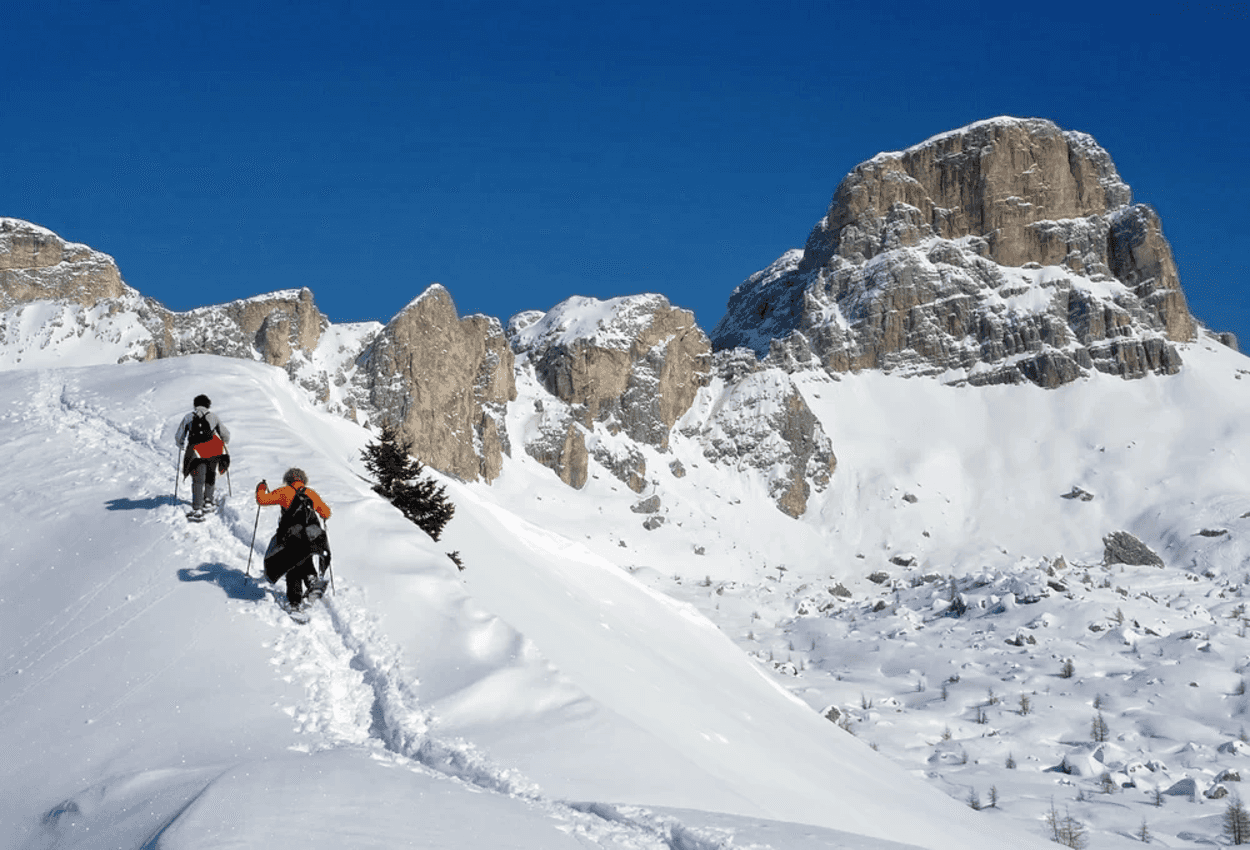Snowshoeing in Fedare, Dolomites.