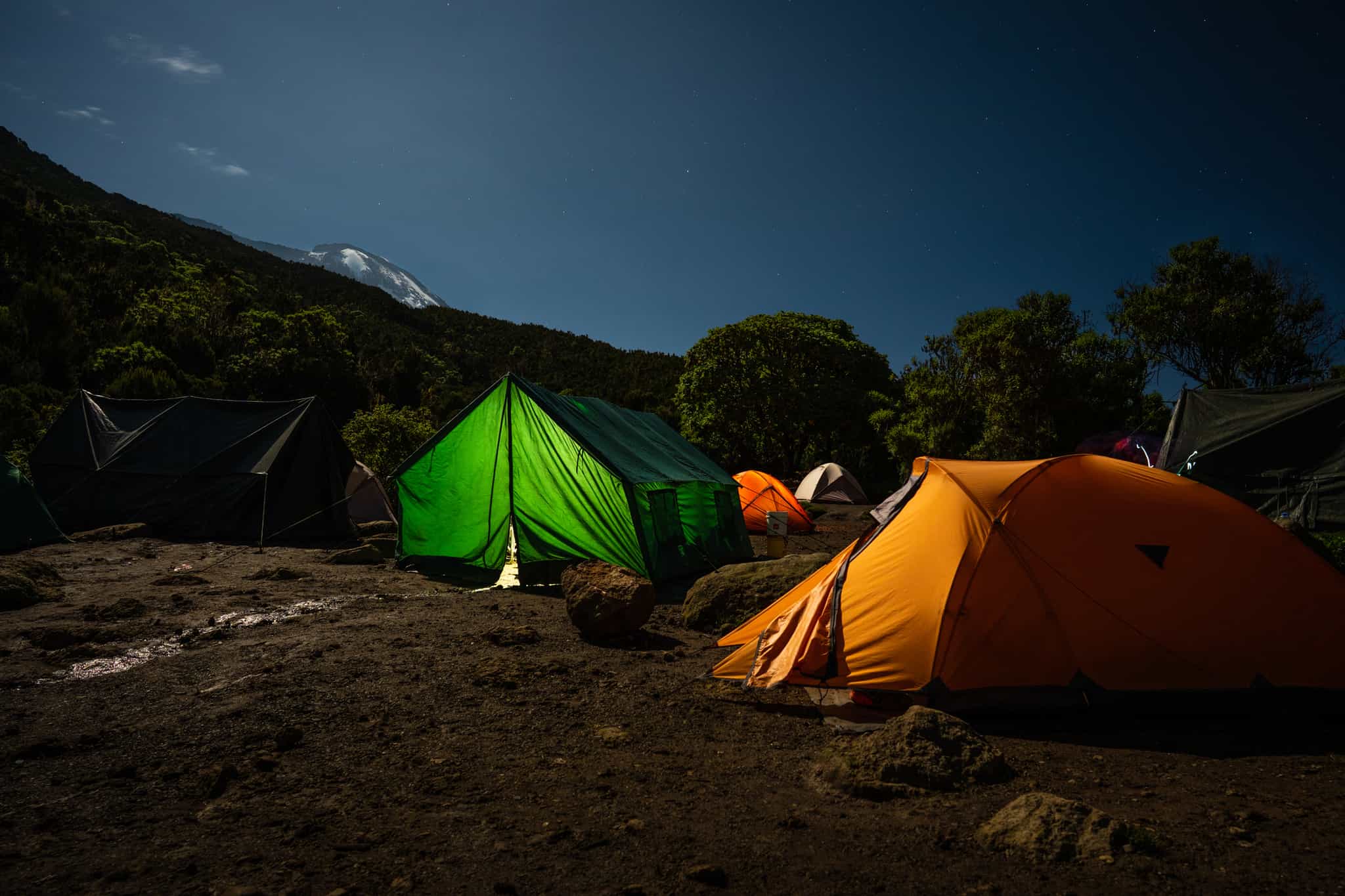 Machame Camp with a view of Mount Kilimanjaro, Tanzania. Photo: GettyImages-1133860857