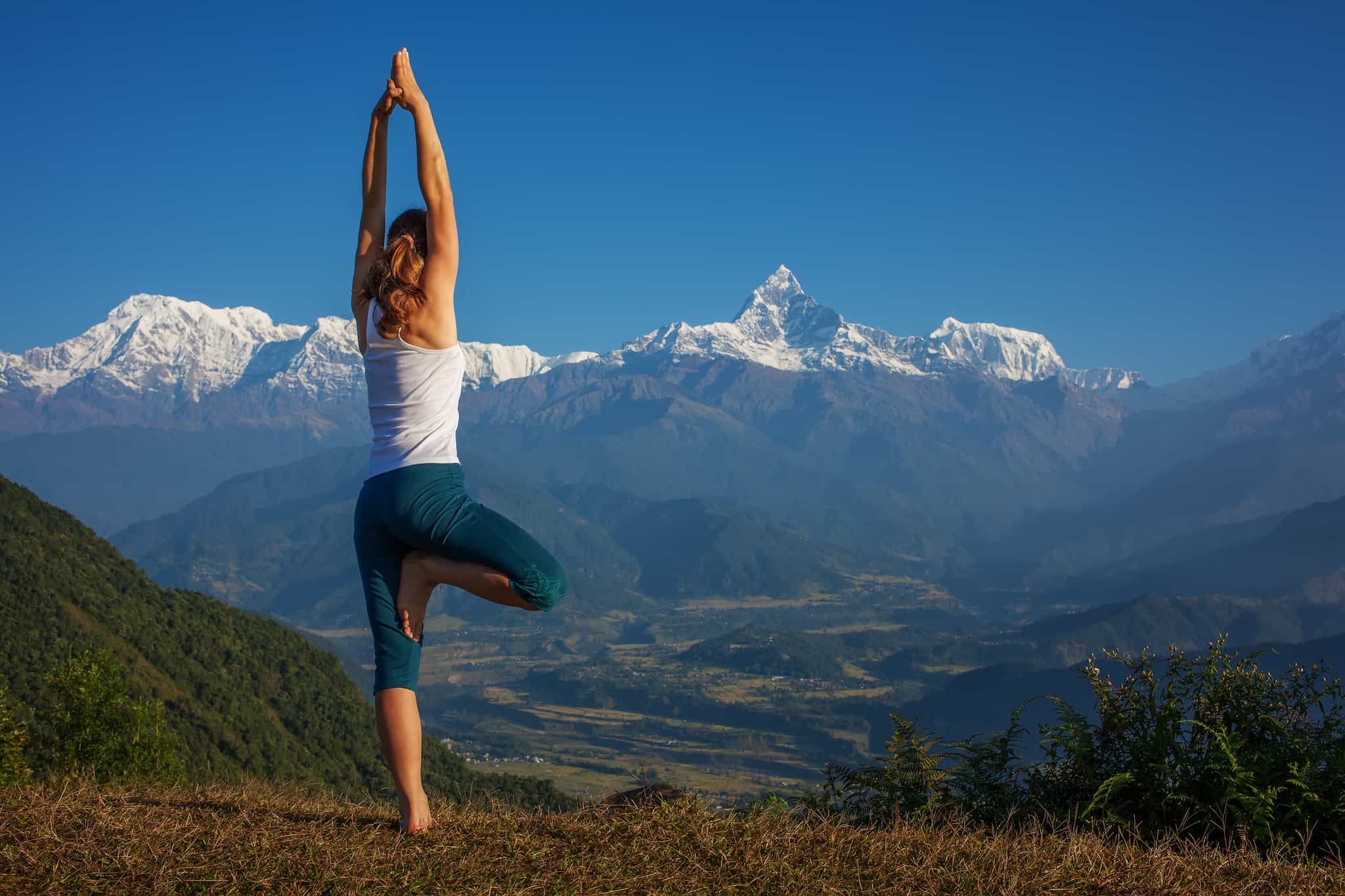 Yoga with Annapurnas view, Nepal