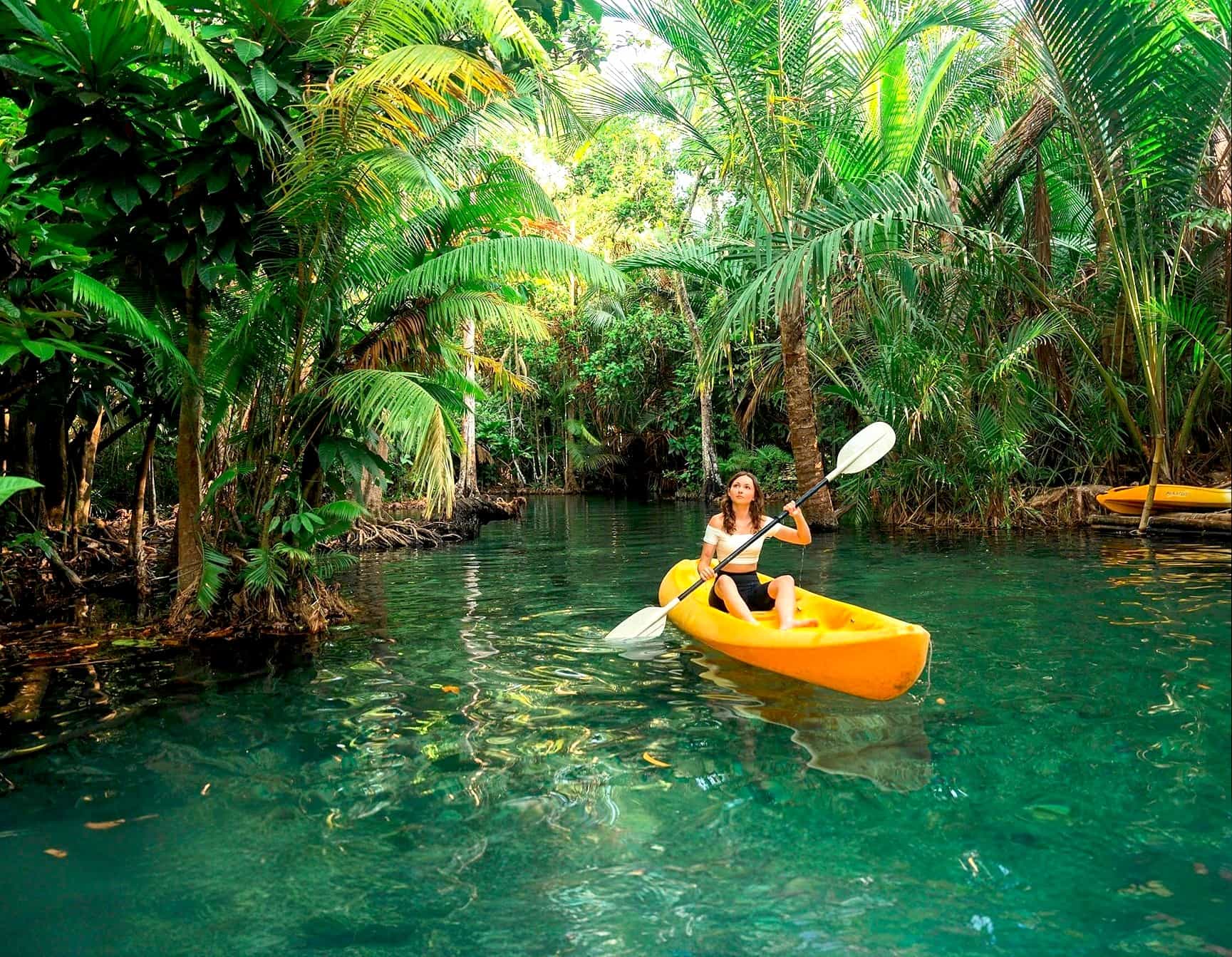 Woman kayaking through the mangroves in Costa Rica, Image: GettyImages-1688984730