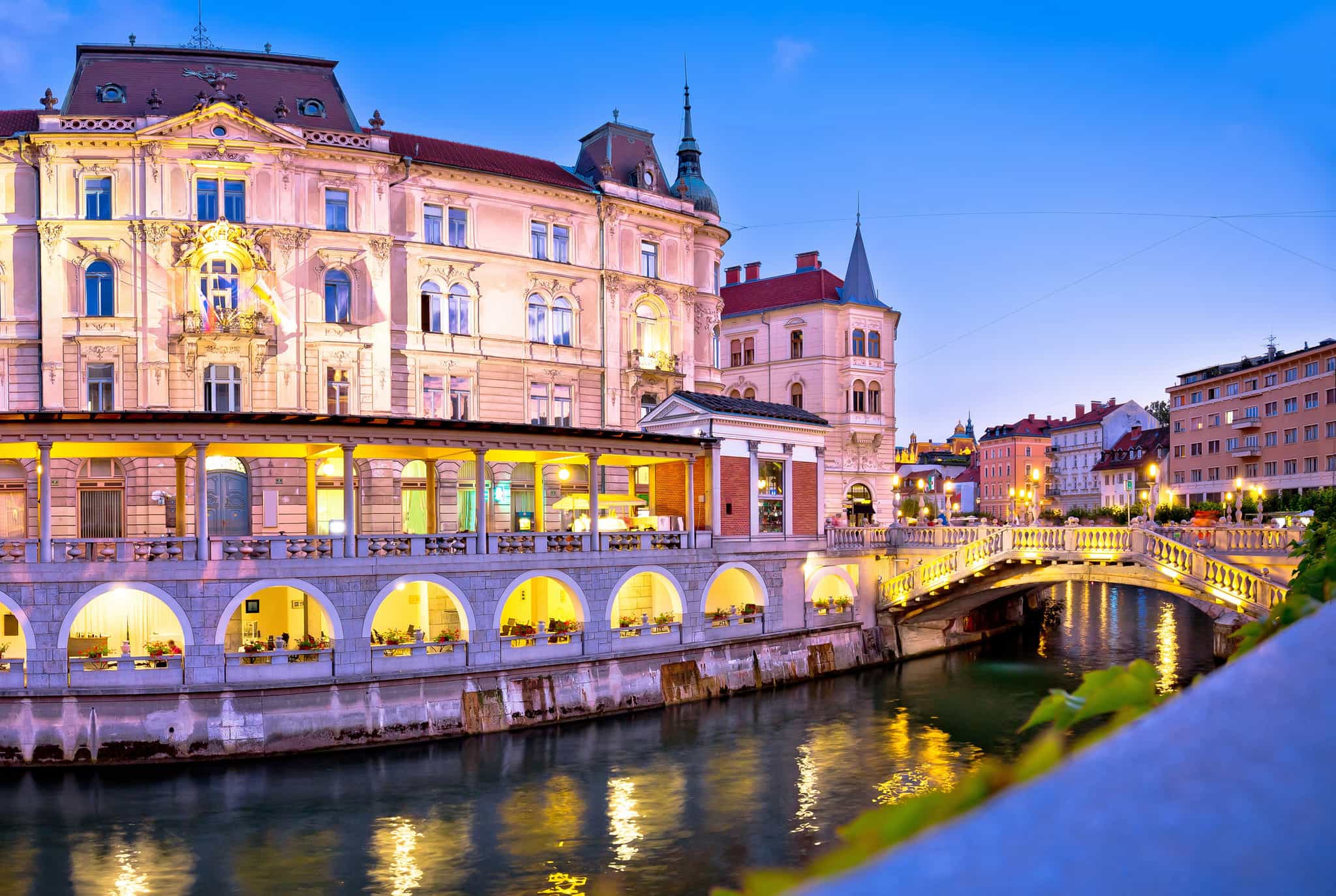 View of Ljubliana riverfront by night. Photo: GettyImages-636939554