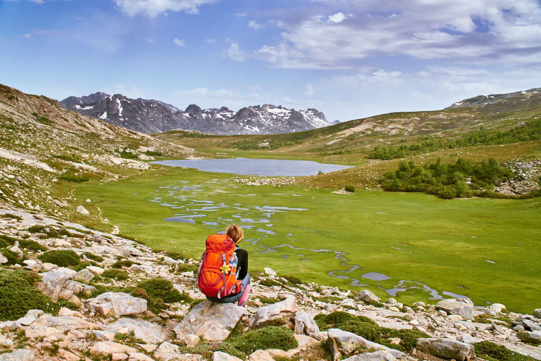 Trekker looking over the Lac de Nino on the GR20 in Corsica