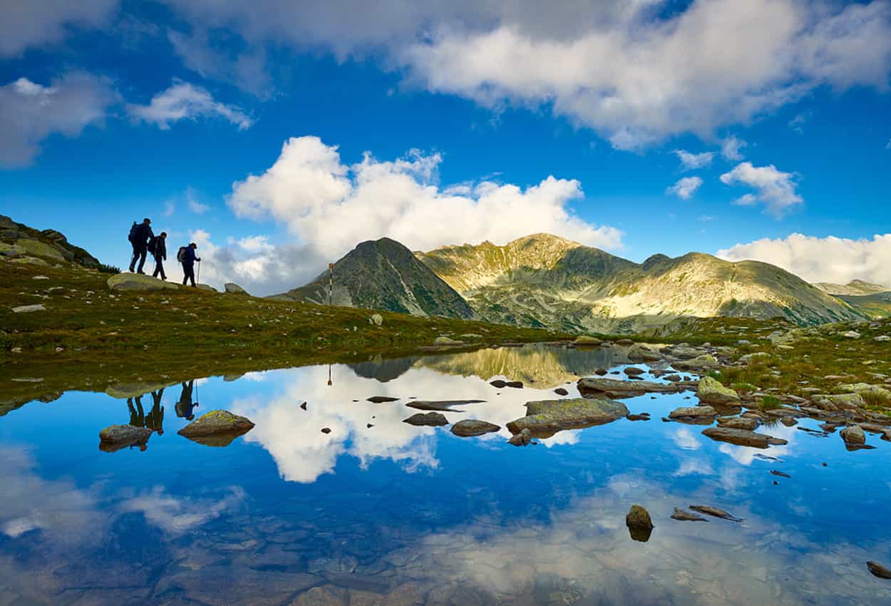 Hikers by glacial lakes in the Retezat Mountains, Romania. Photo: host, Apuseni.