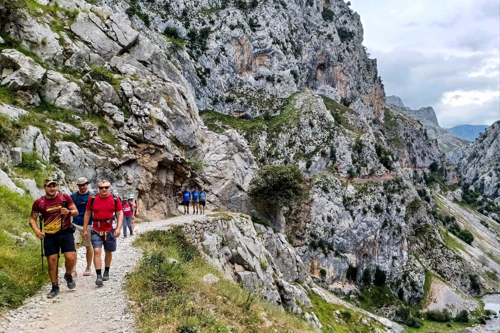 Hikers on the Cares Gorge path in Picos de Europa, Spain.