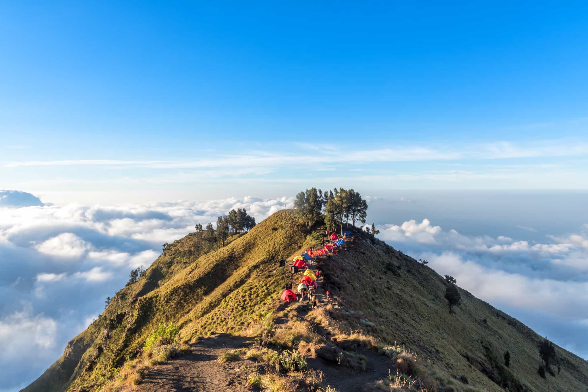 Camping site on crater rim of Mount Rinjani at sunset. Lombok Island, Indonesia.