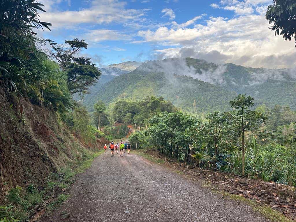 Hikers on a gravel road in Costa Rica.