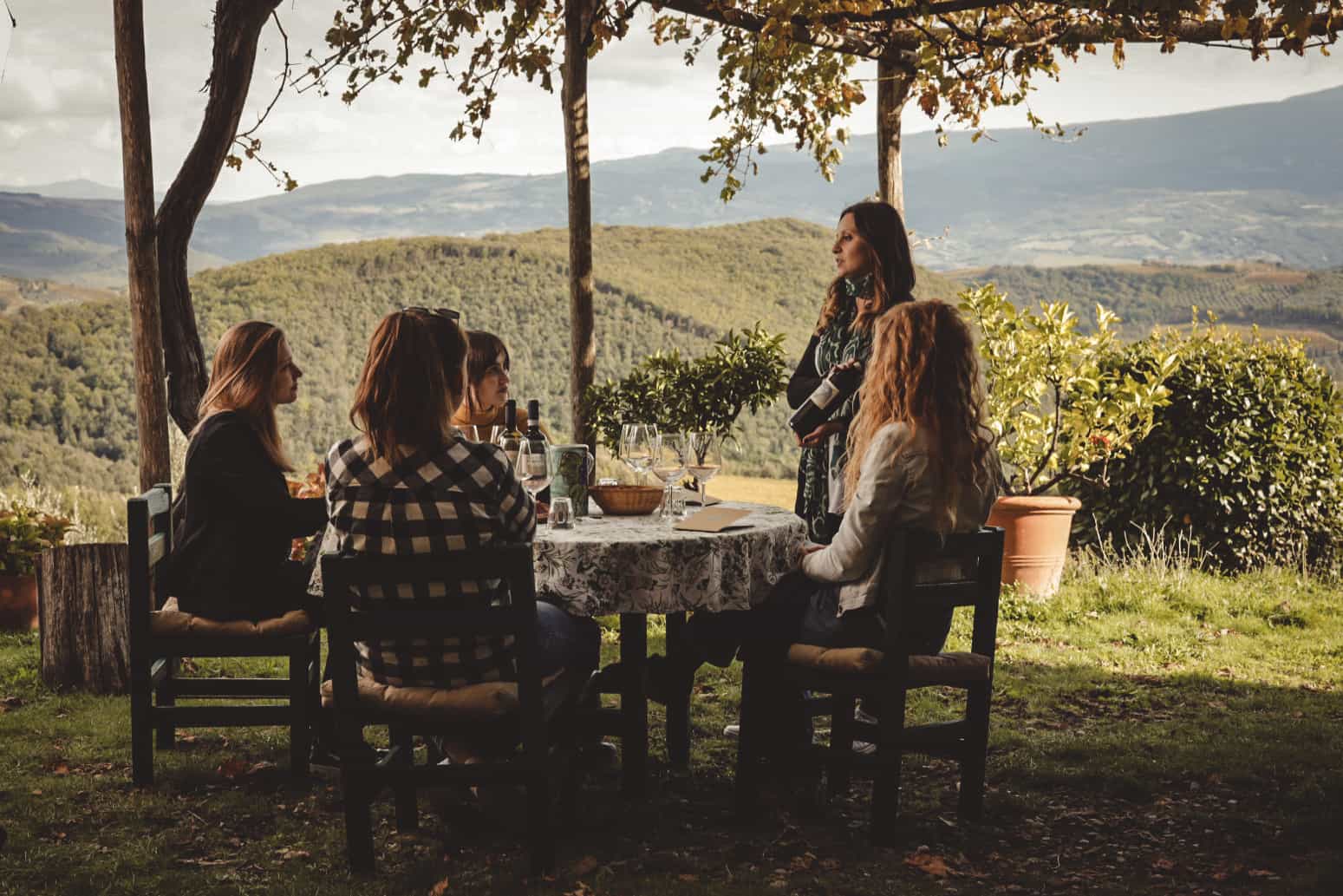 Group enjoying a wine tasting at La Magia Farm, Tuscany.