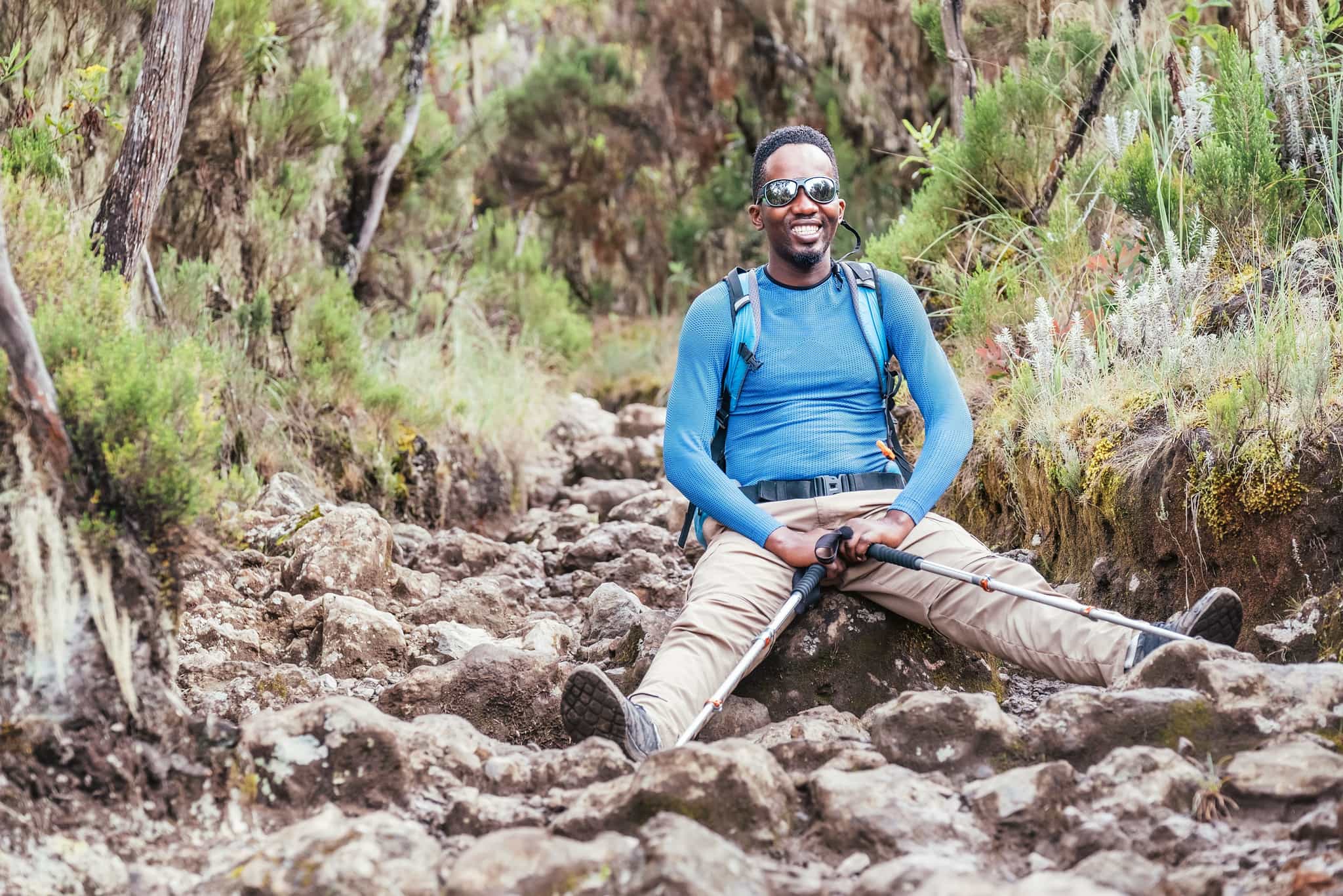 Hiker rests on the Rongai Route, Kilimanjaro. Photo: GettyImages-1298962164