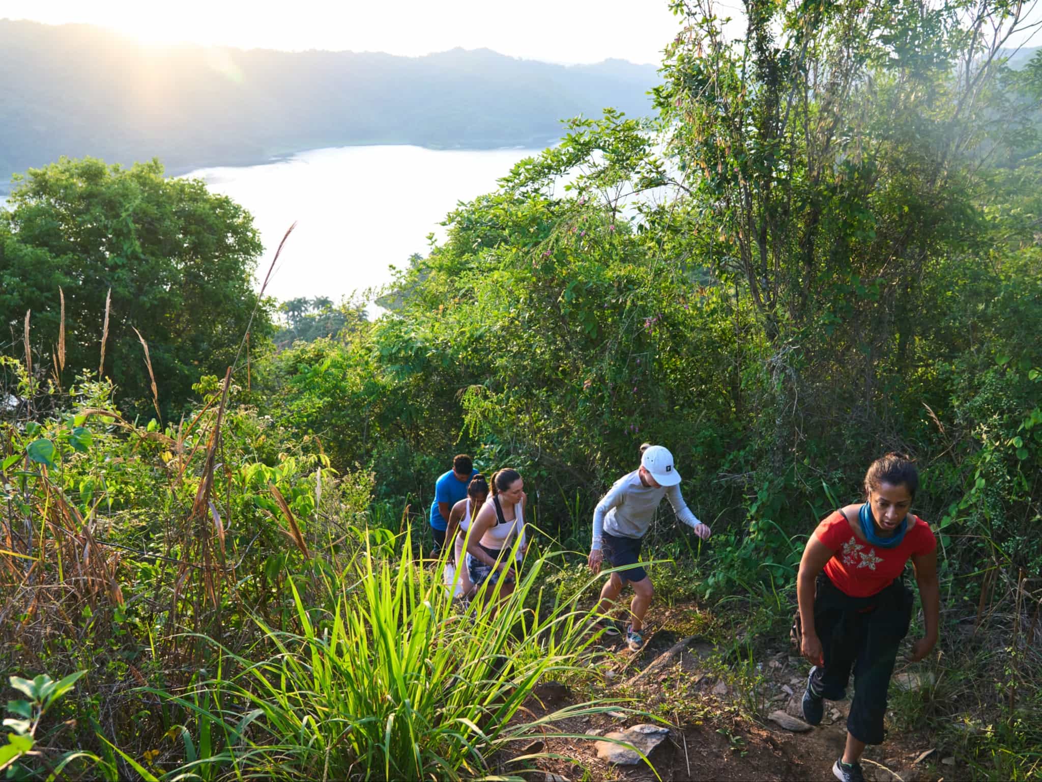 Hiking through lush vegetation with lake views in Cuba, Photo: Commissioned/Daniel Wildey