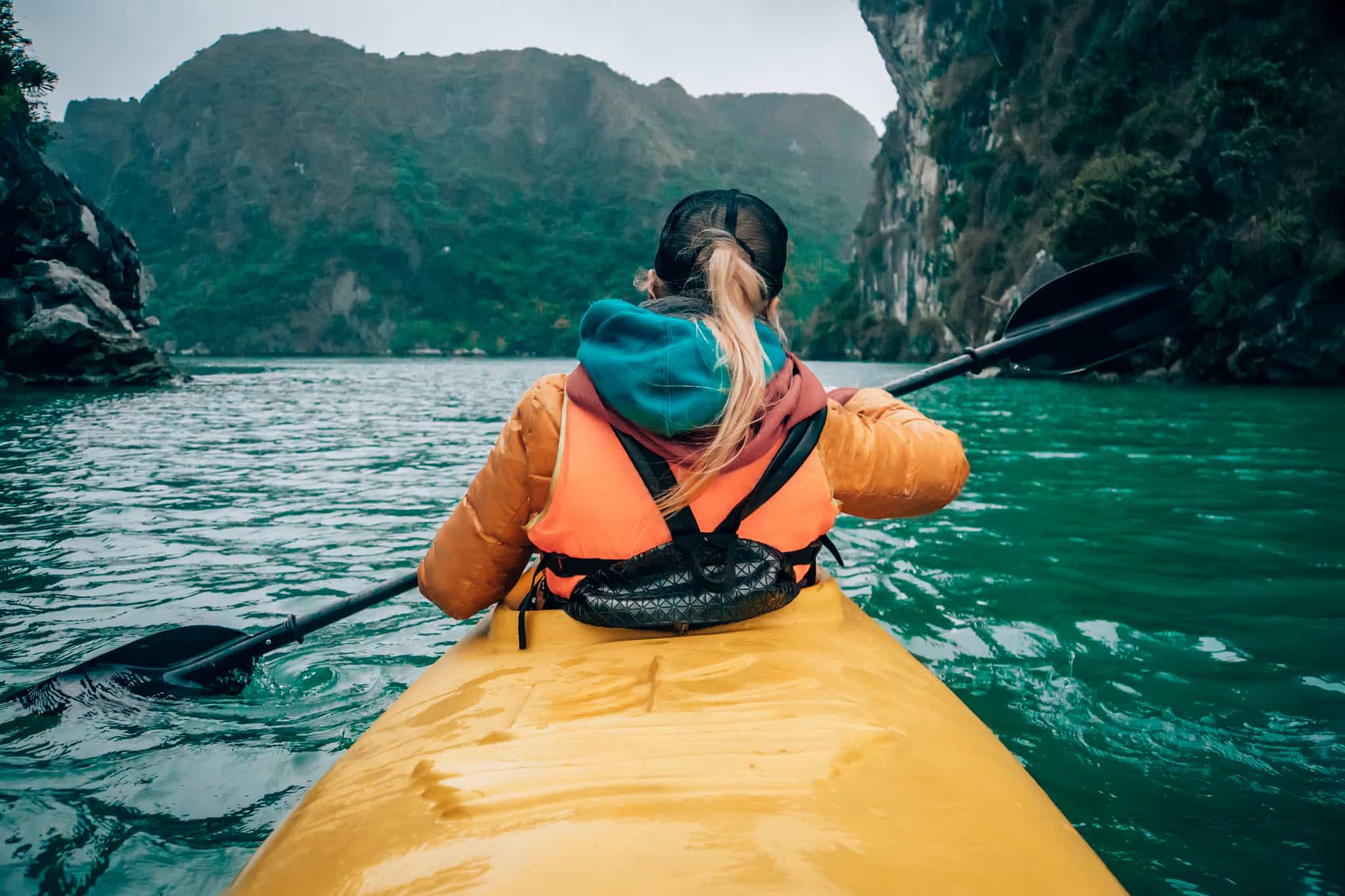 Woman kayaking in Halong Bay, Vietnam. Photo: GettyImages-1191131412