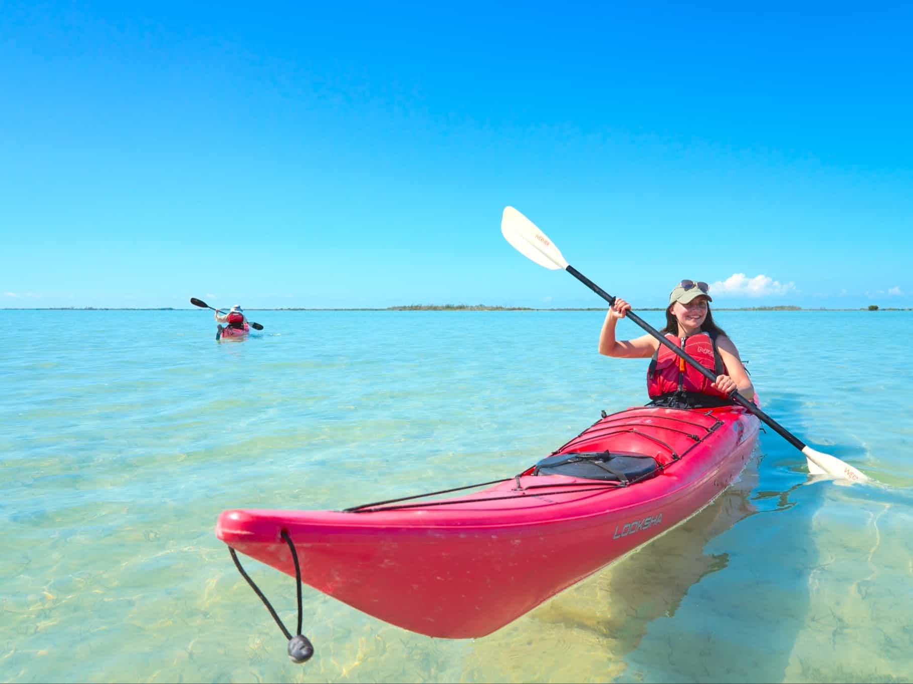 Two people kayaking on crytal clear water in Salinas de Brito, Cuba. Photo: Commissioned/Daniel Wildey