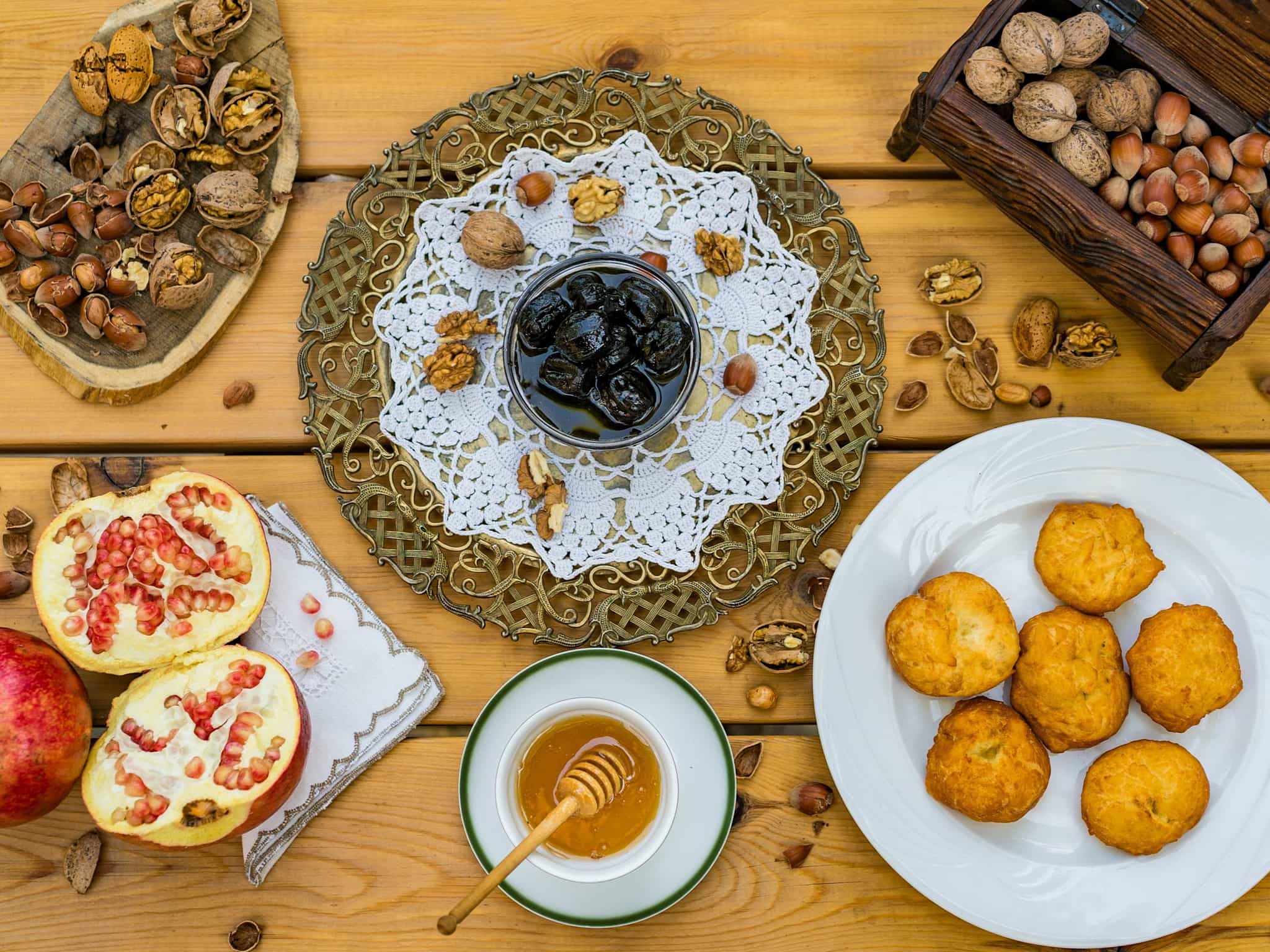 Albanian honey, fruits and nuts laid out on a table.