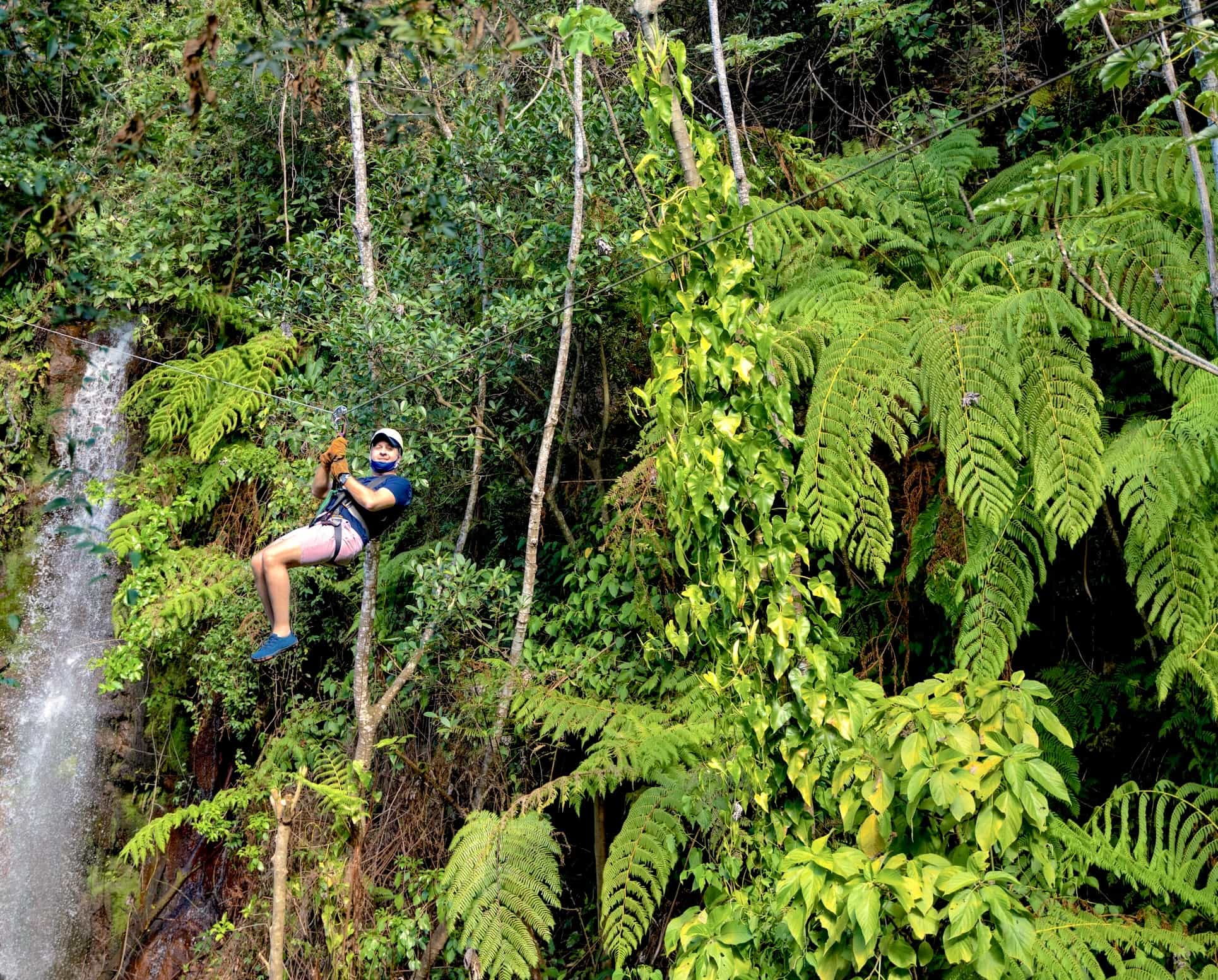 Zip line in Costa Rica against green foliage GettyImages-1295105179