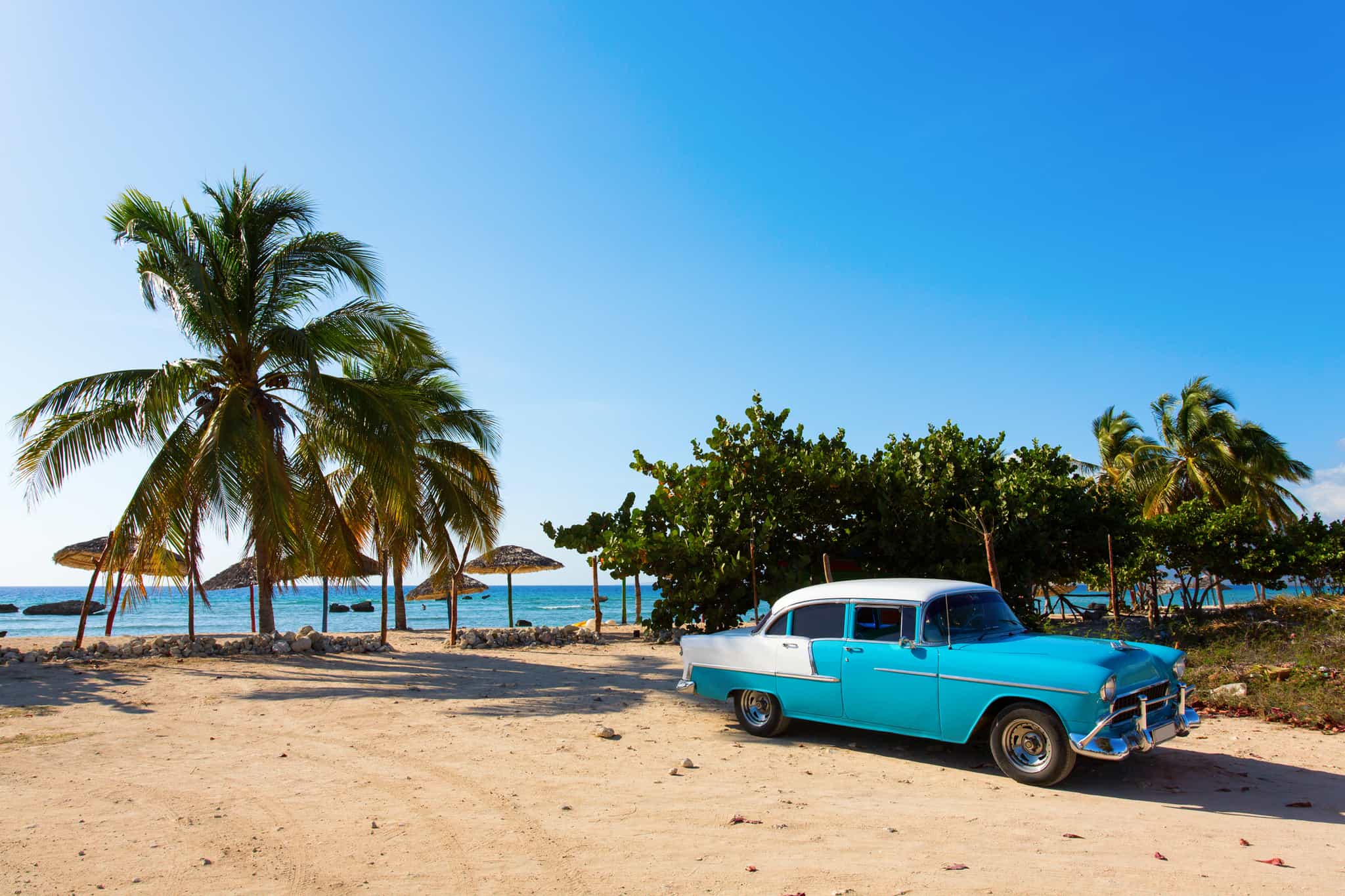 Car & beach, Cuba. Photo: GettyImages-469739618