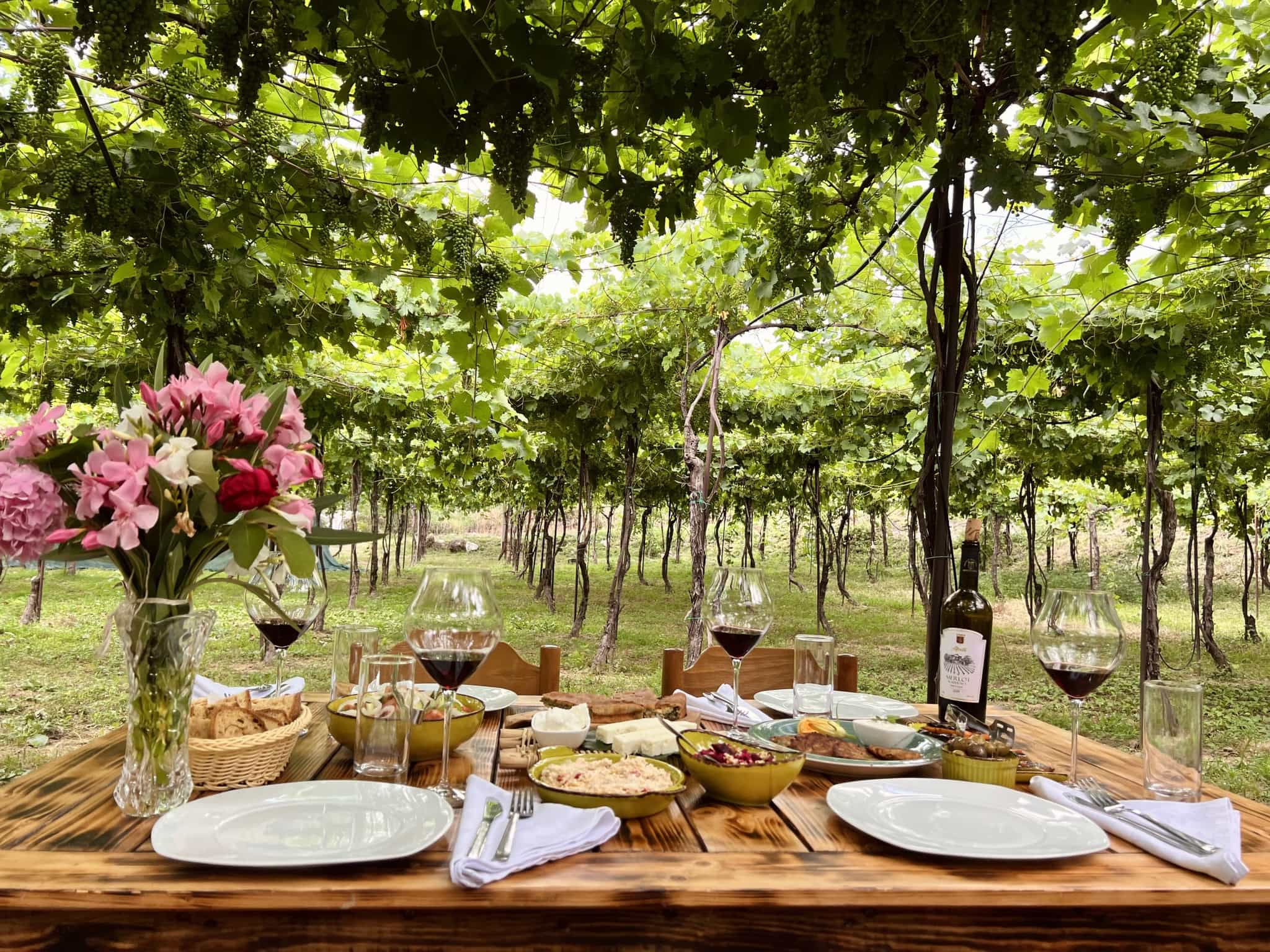 Table with food and wine at Alpeta Winery, Albania. Photo: Alpeta Winery