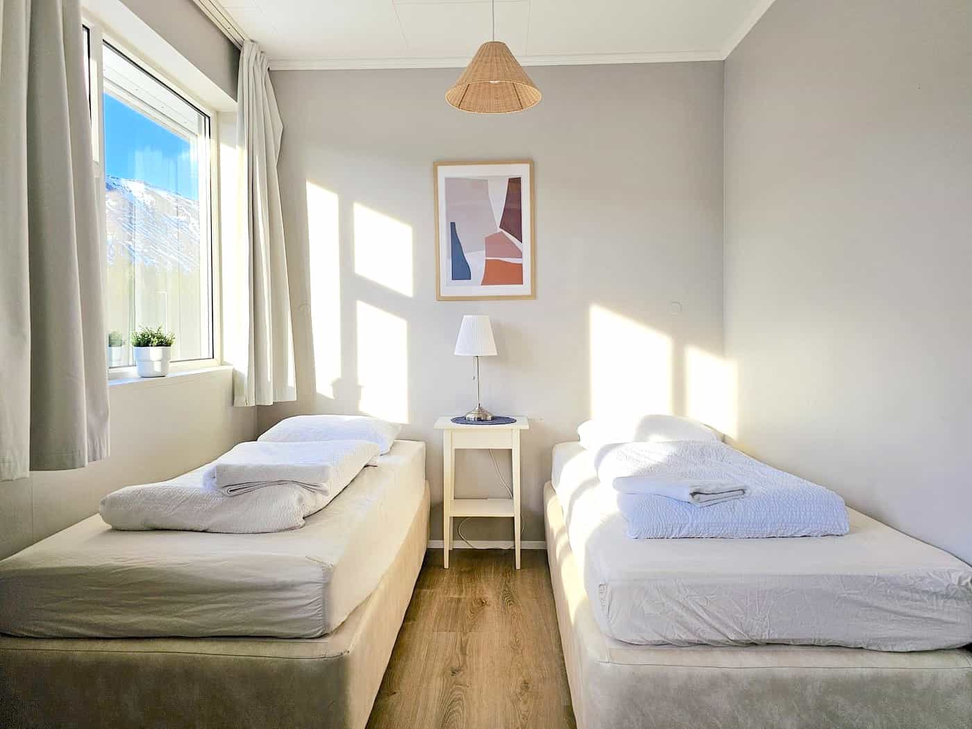 Clean, white bedroom with twin beds at hotel LAUGARVATN, Iceland Photo: Tripadvisor