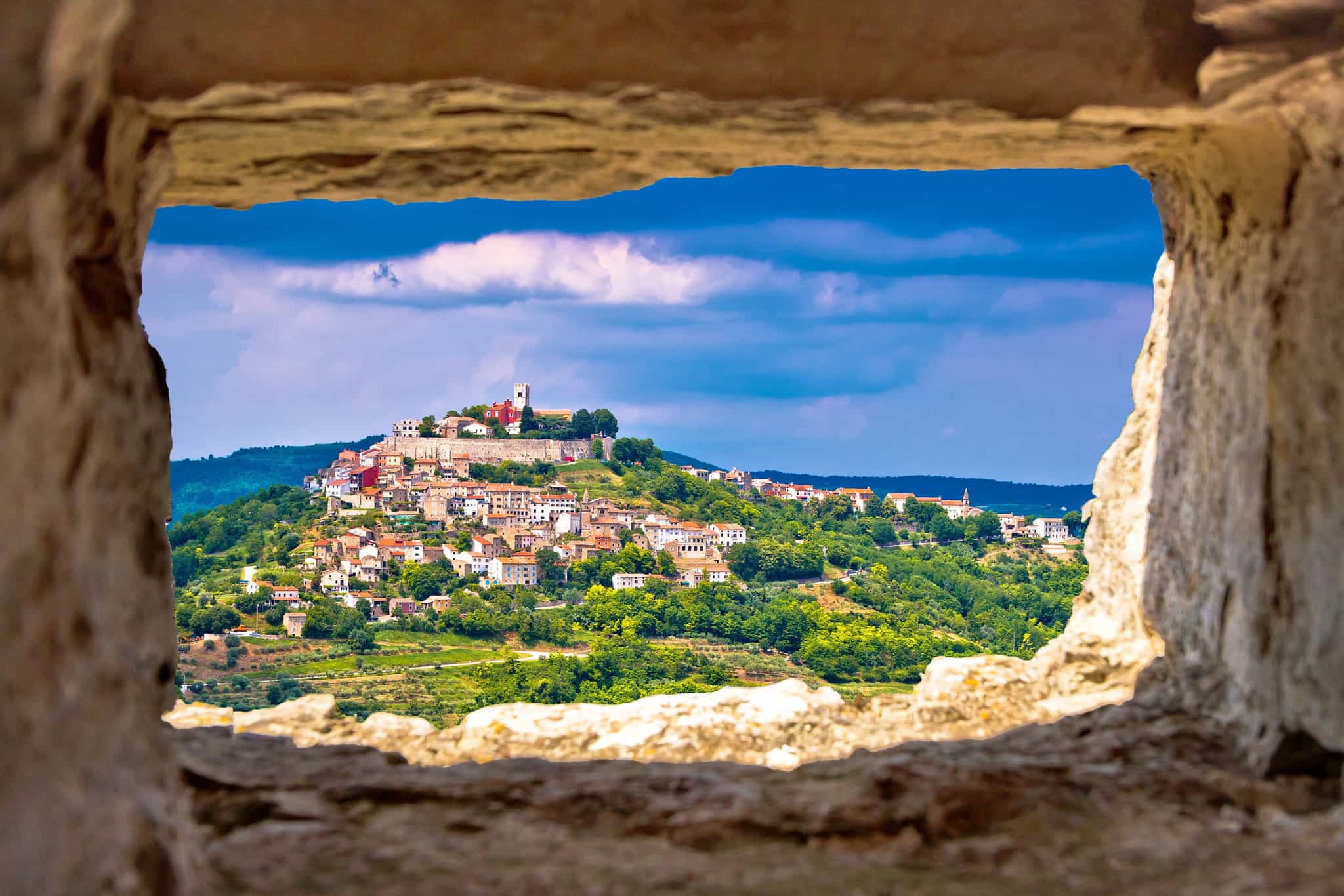 View of Motovun through a stone window, Istria, Croatia Photo: GettyImages-606673988 (1)