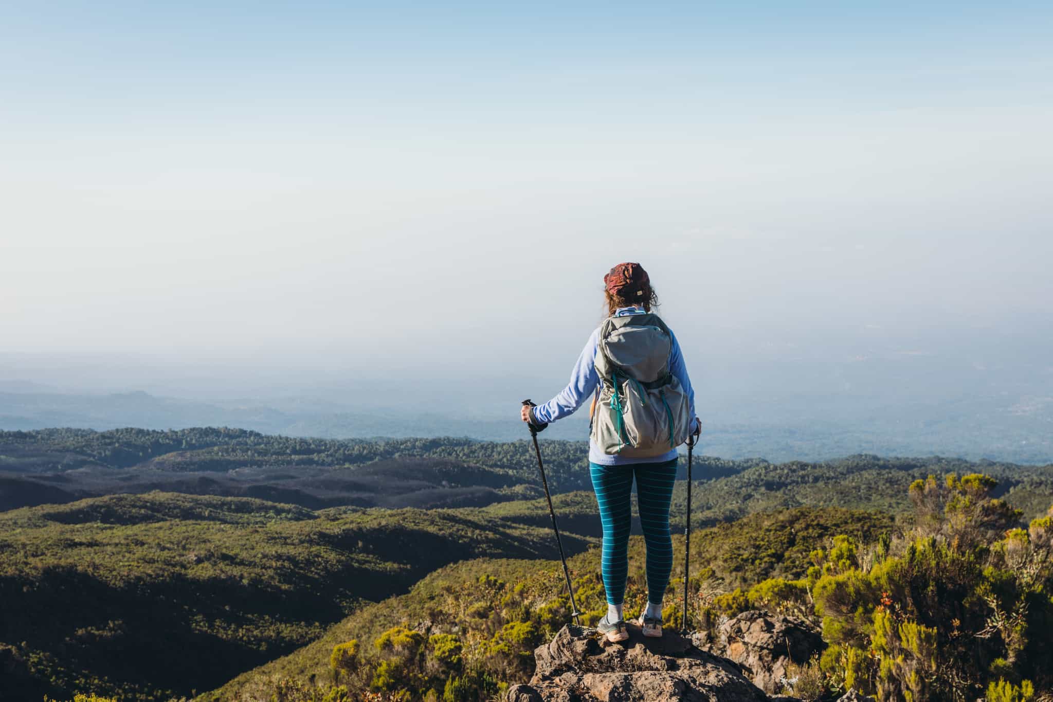 Woman overlooking view of Kilimanjaro forest zone. Photo: GettyImages-1307035934